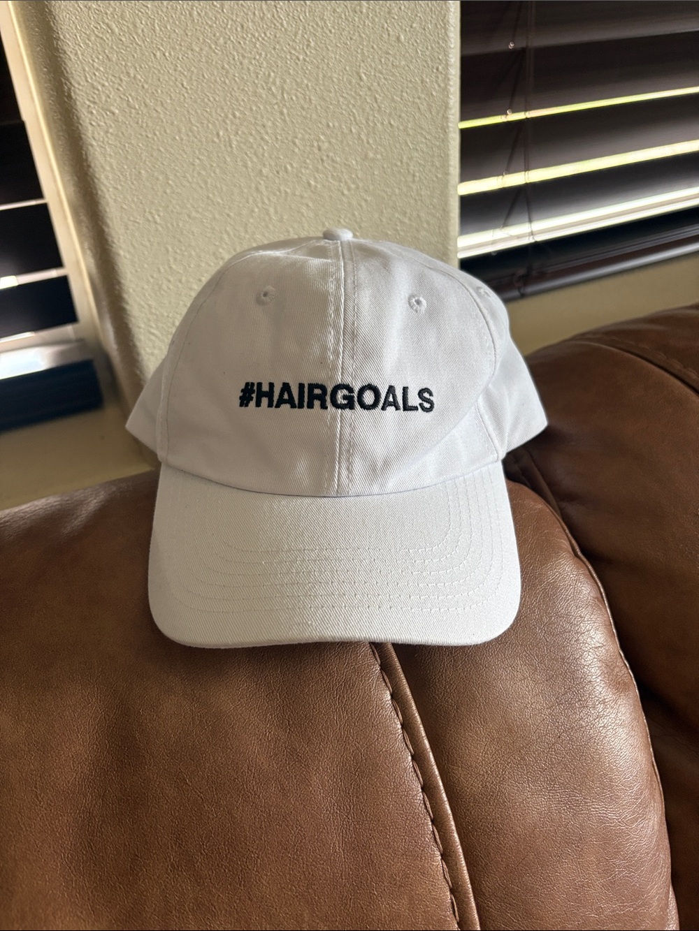 Kids White Baseball Cap with #HAIRGOALS Embroidery